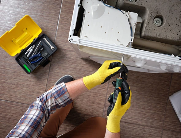 Affordable Appliance technician inspecting an appliance for restoration