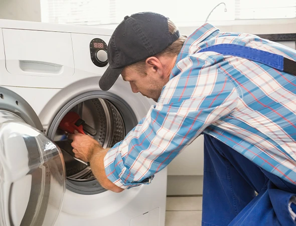 Affordable Appliance technician performing washer motor repair in Meridian ID